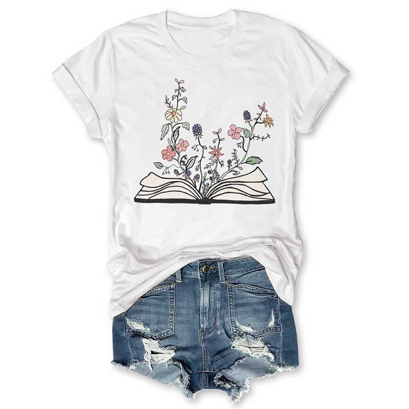 Fleurs poussant à partir de livre T-shirt