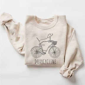 Doxycycline Dachshund on Bicycle Sweatshirt